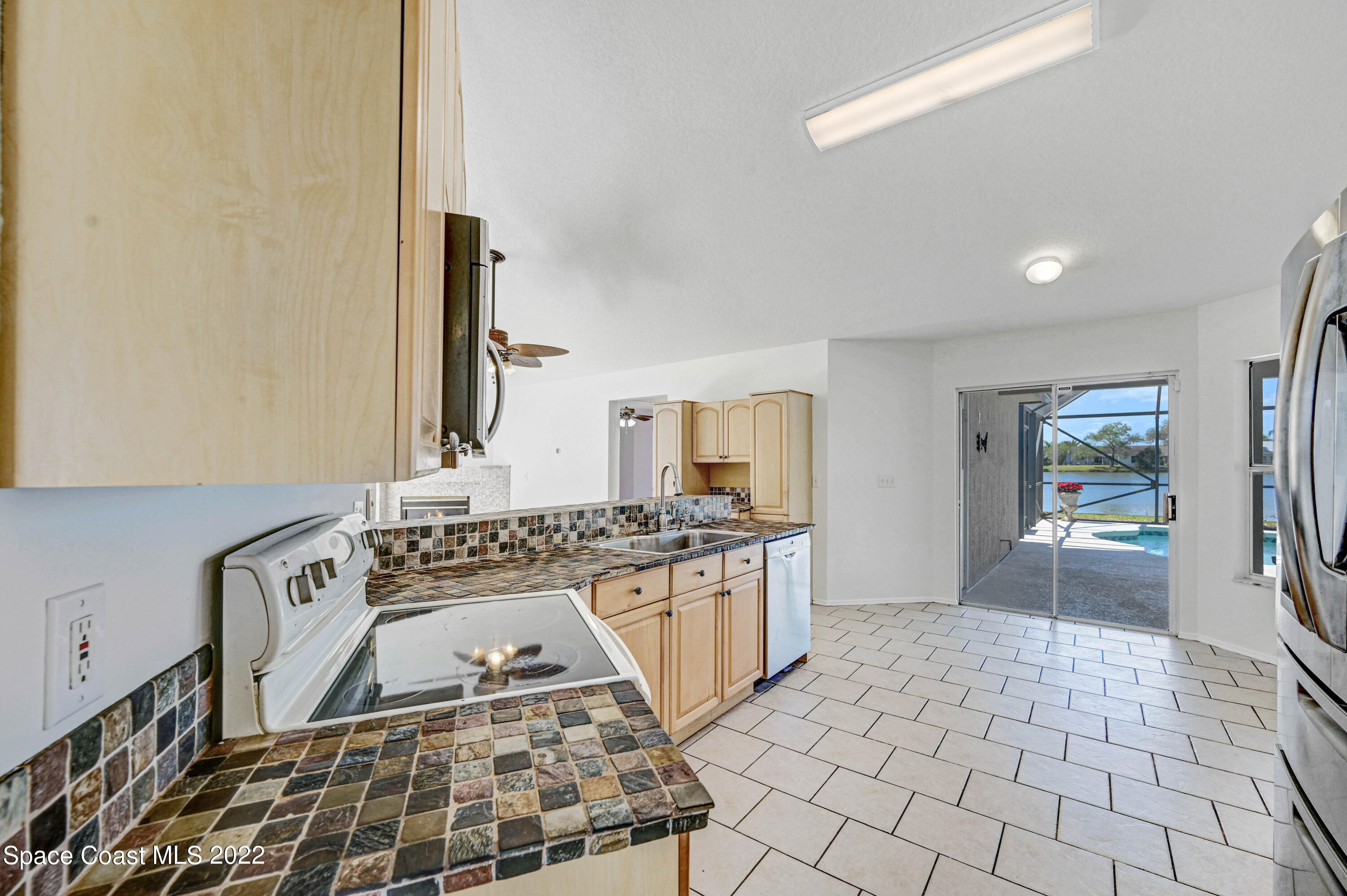 930 Turtle Pond Way Melbourne, FL 32940 - Photo 23 of 56 Kitchen to Pool