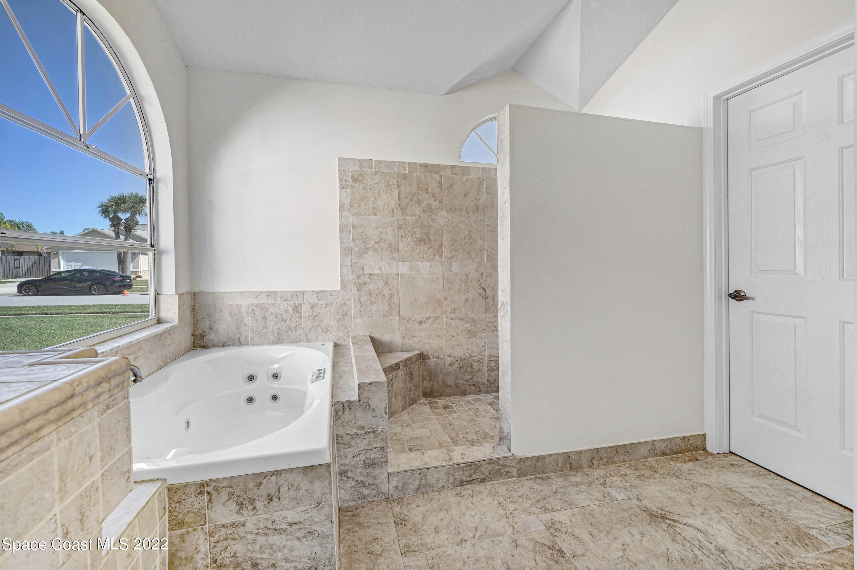 930 Turtle Pond Way Melbourne, FL 32940 - Photo 30 of 56 a bathroom with a bathtub and a shower