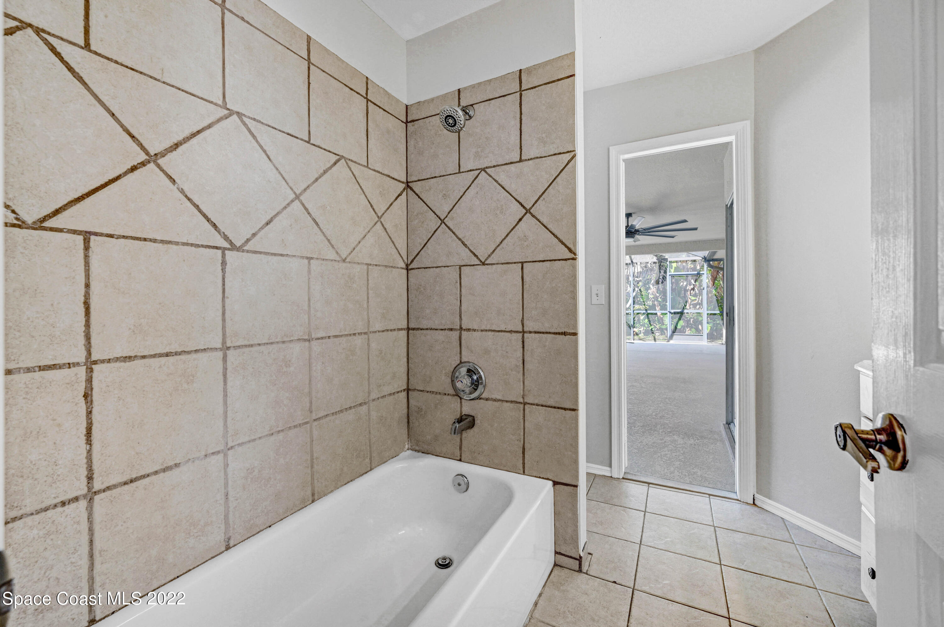 930 Turtle Pond Way Melbourne, FL 32940 - Photo 34 of 56 a bathroom with a bathtub and shower