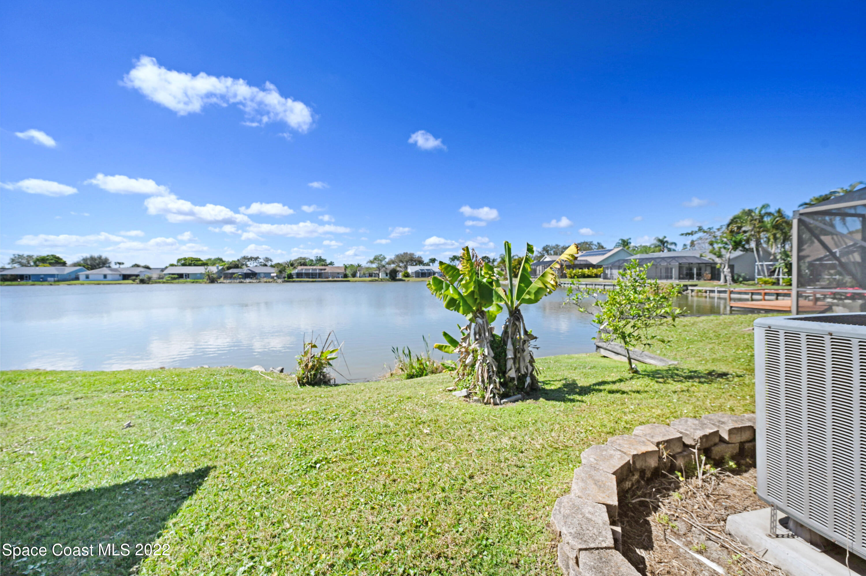 930 Turtle Pond Way Melbourne, FL 32940 - Photo 43 of 56 a view of a lake with a big yard