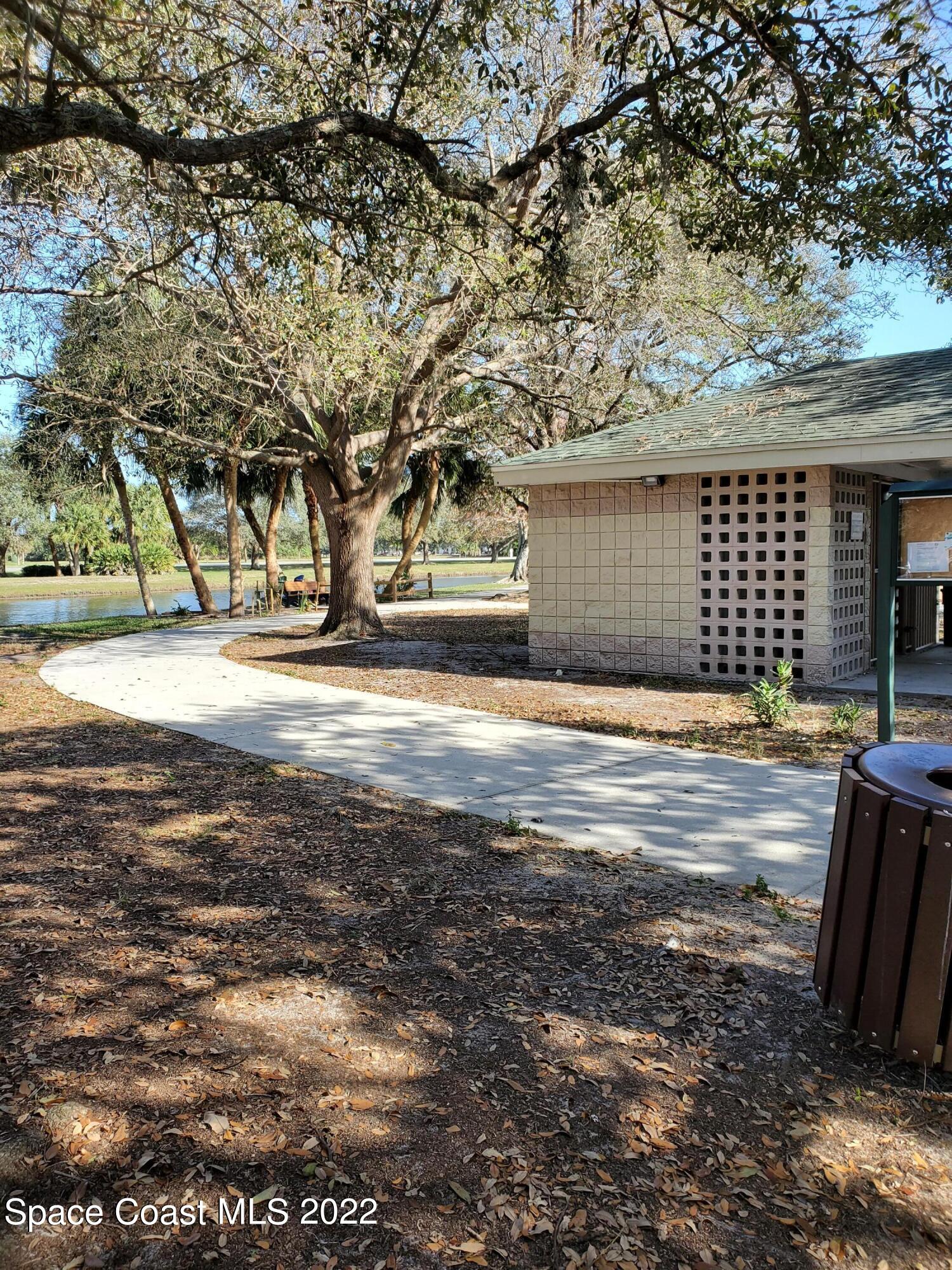 930 Turtle Pond Way Melbourne, FL 32940 - Photo 48 of 56 a view of a yard with large tree