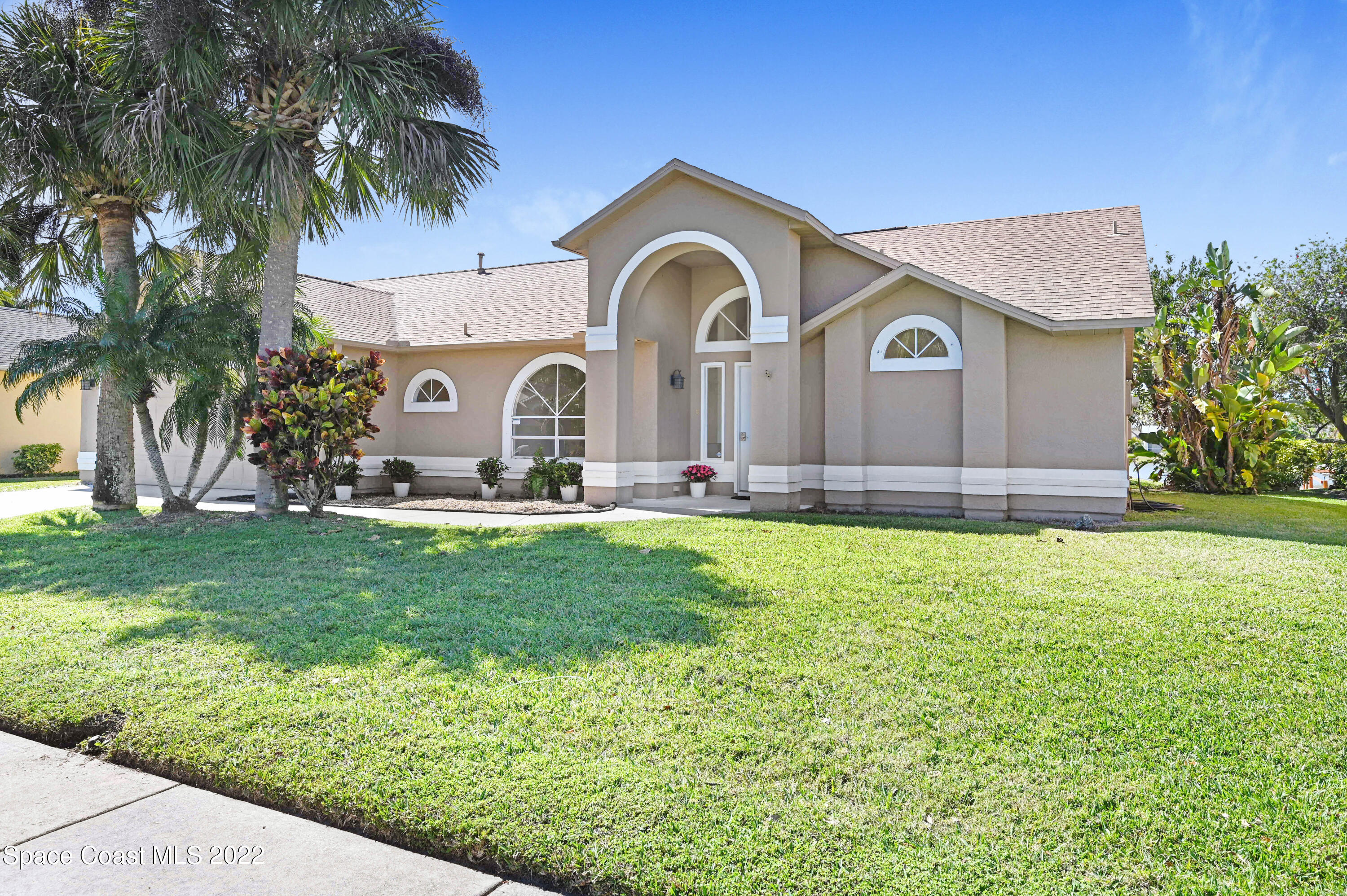 930 Turtle Pond Way Melbourne, FL 32940 - Photo 50 of 56 a front view of a house with garden