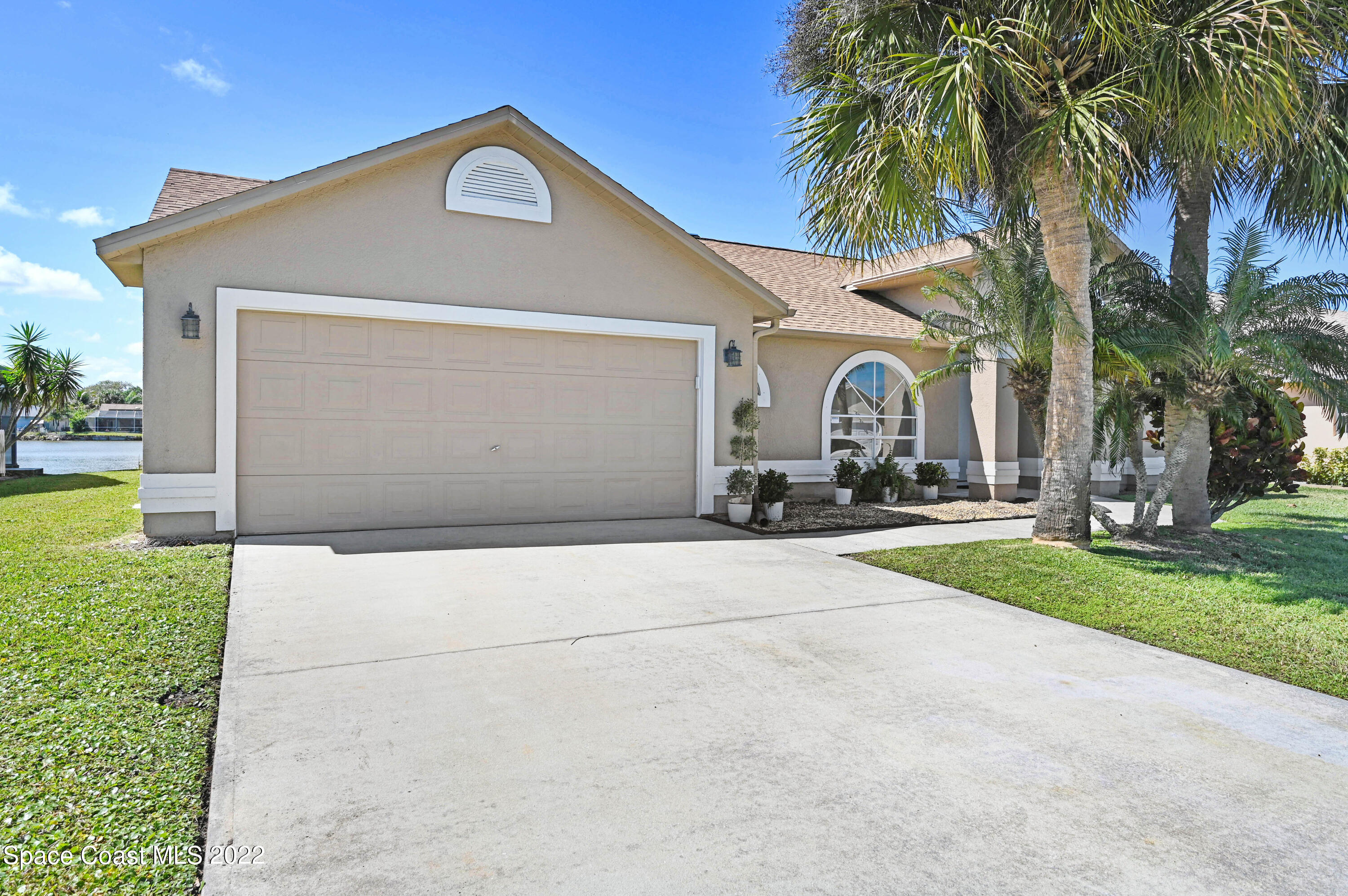 930 Turtle Pond Way Melbourne, FL 32940 - Photo 51 of 56 a front view of house with yard and green space