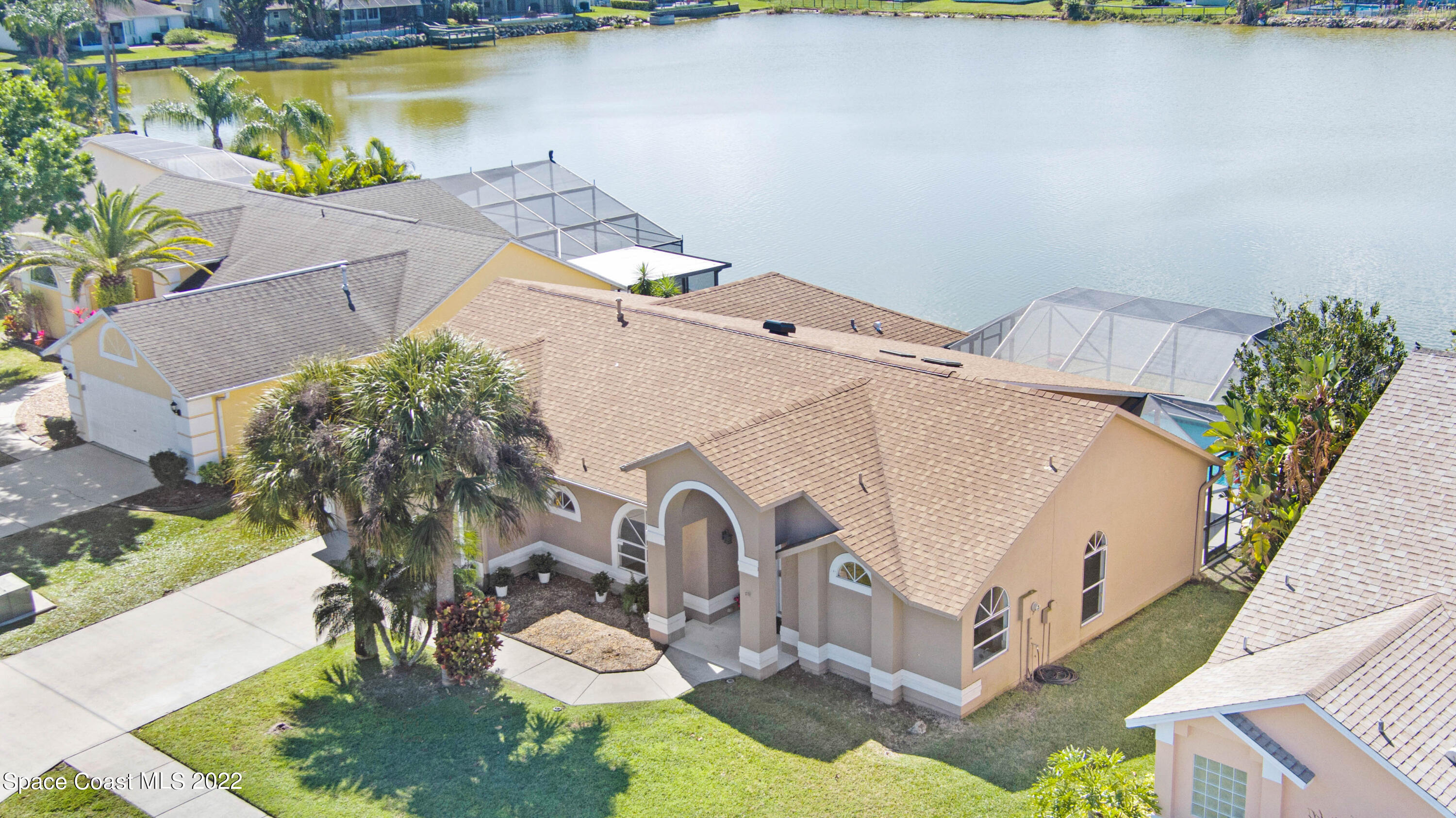 930 Turtle Pond Way Melbourne, FL 32940 - Photo 54 of 56 a aerial view of a house with a yard and a large pool