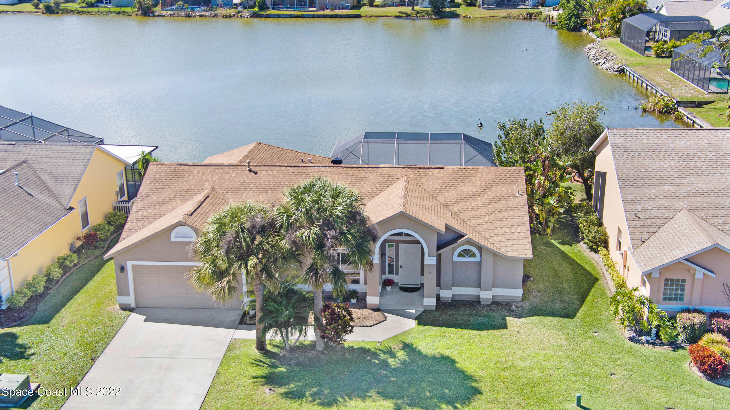 930 Turtle Pond Way Melbourne, FL 32940 - Photo 55 of 56 an aerial view of a house with a yard