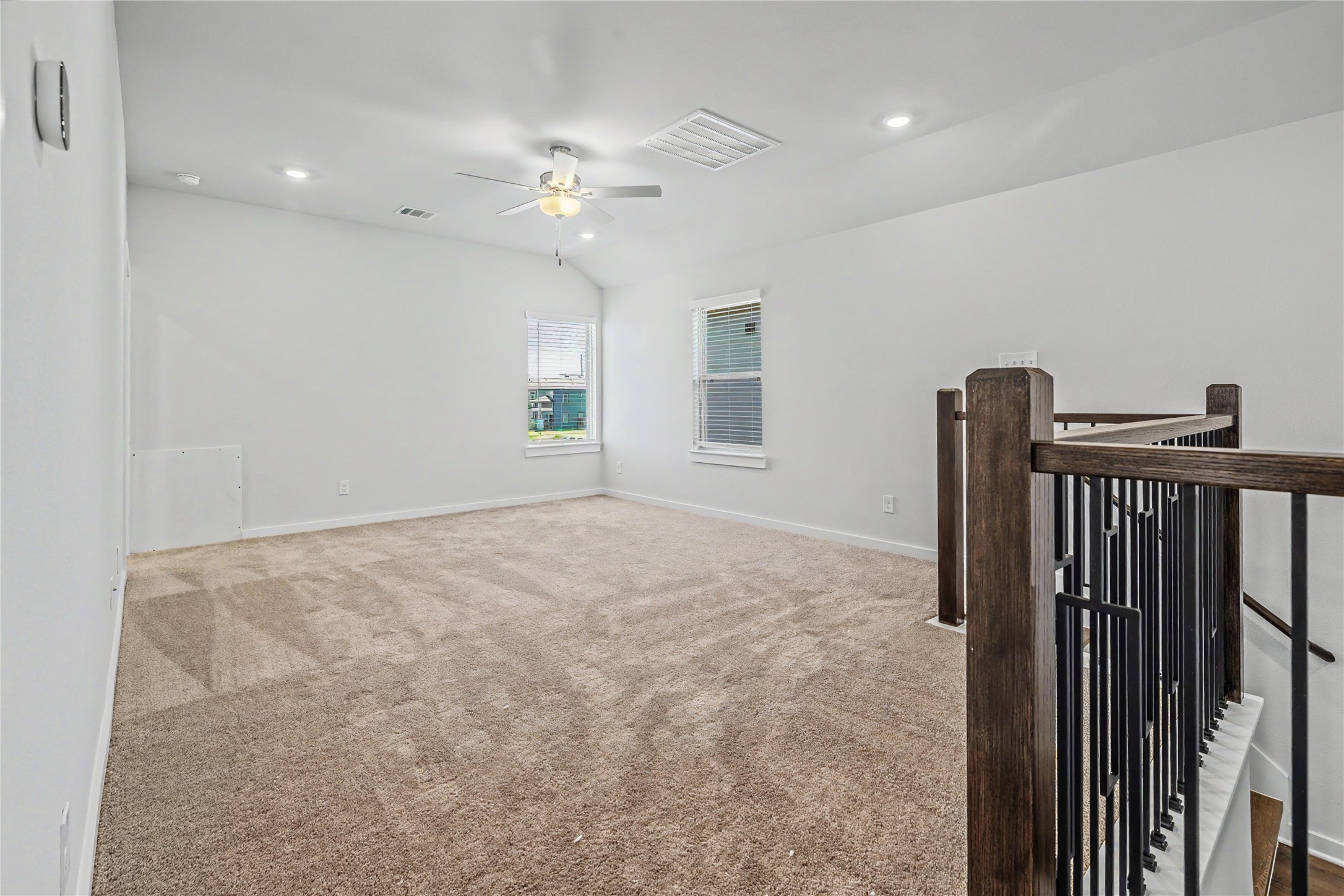 6423 Bolinas Court Rosharon, TX 77583 - Photo 30 of 39 a view of an empty room with wooden floor and fan
