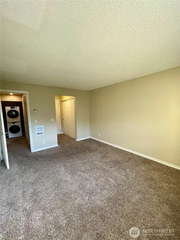 an empty room with a fireplace