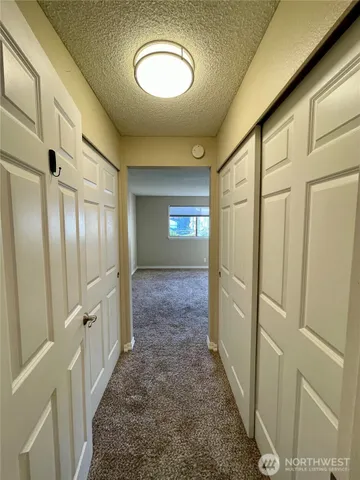 a view of gallery with wooden floor