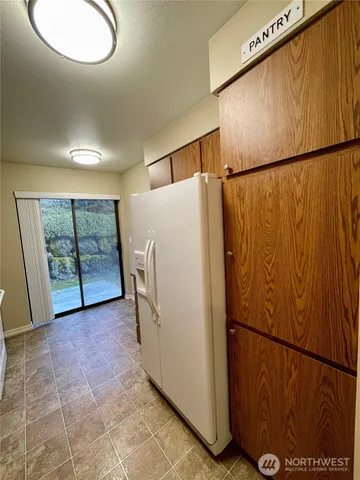 a view of a storage & utility room with racks on the wall