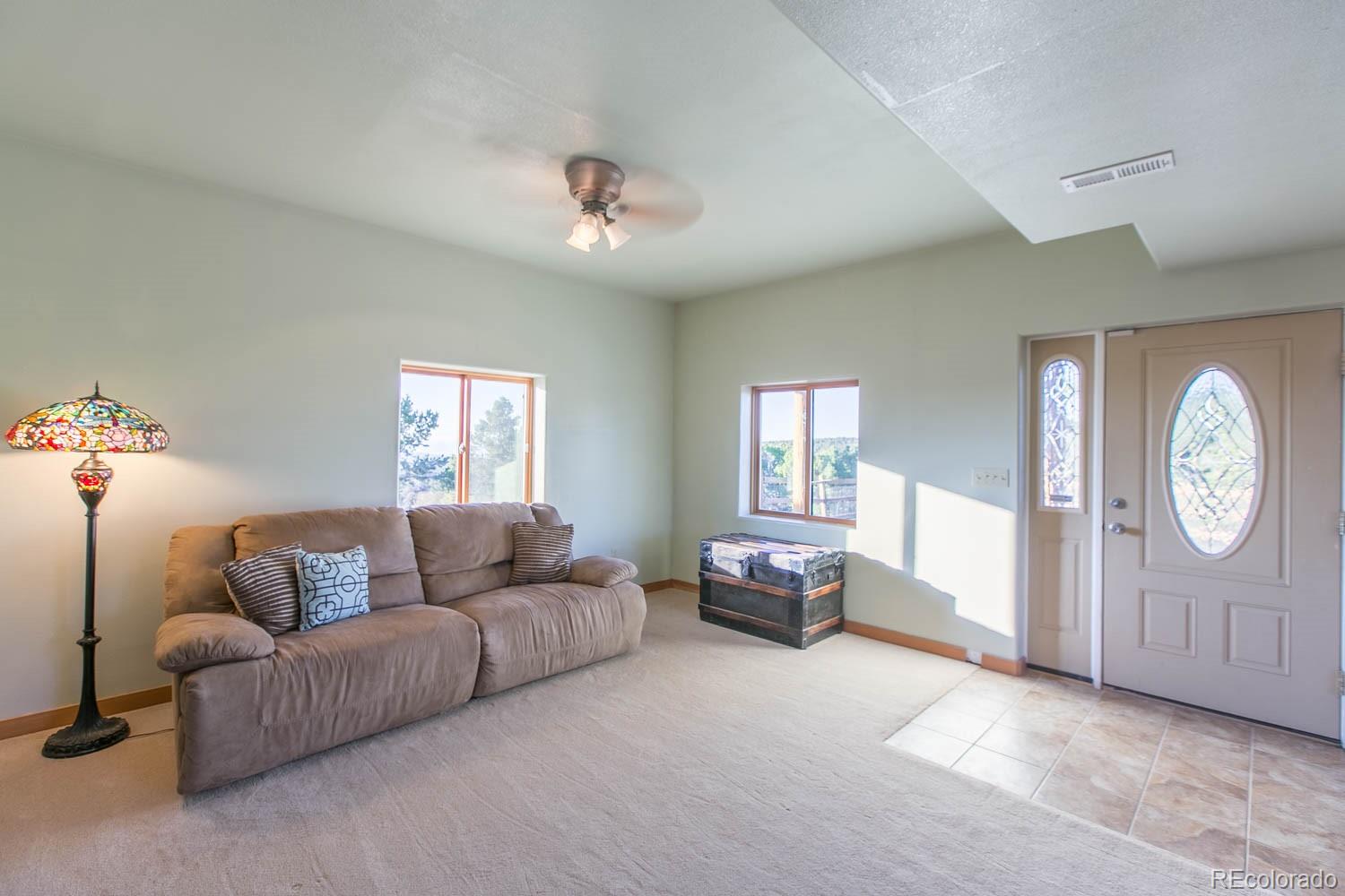 18342 Miller Canyon Ranch Road Glade Park, CO 81523 - Photo 22 of 38 a living room with furniture and a window