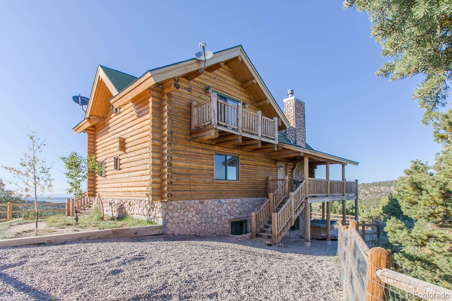 18342 Miller Canyon Ranch Road Glade Park, CO 81523 - Photo 34 of 38 a view of a house with a yard