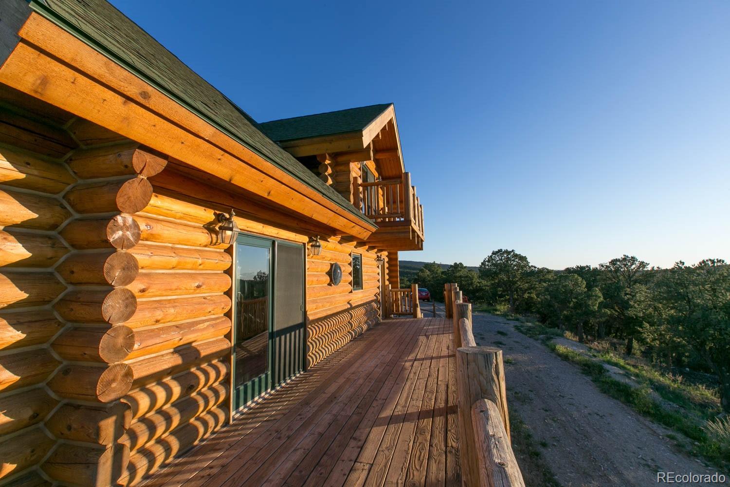 18342 Miller Canyon Ranch Road Glade Park, CO 81523 - Photo 35 of 38 a view of balcony with wooden floor and fence