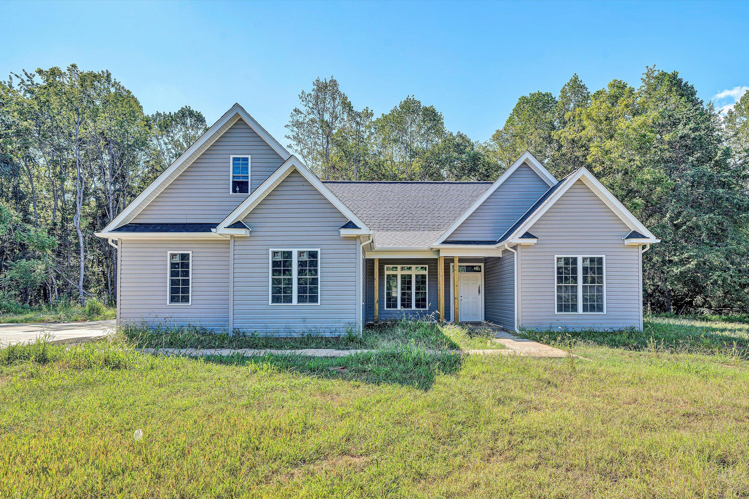 3769 Hales Ford Road Moneta, VA 24121 - Photo 1 of 26 a view of a house with yard and trees in the background