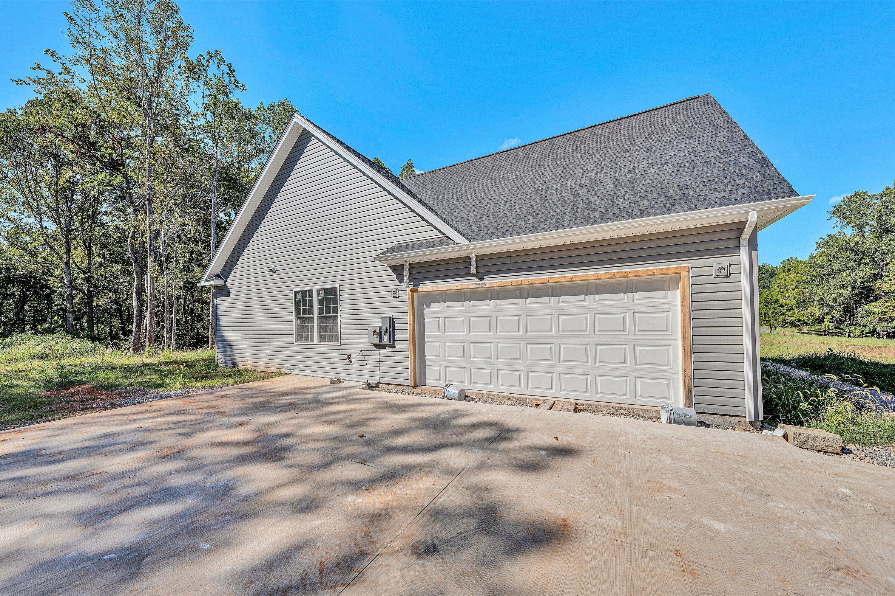 3769 Hales Ford Road Moneta, VA 24121 - Photo 21 of 26 a view of a house with a yard and garage