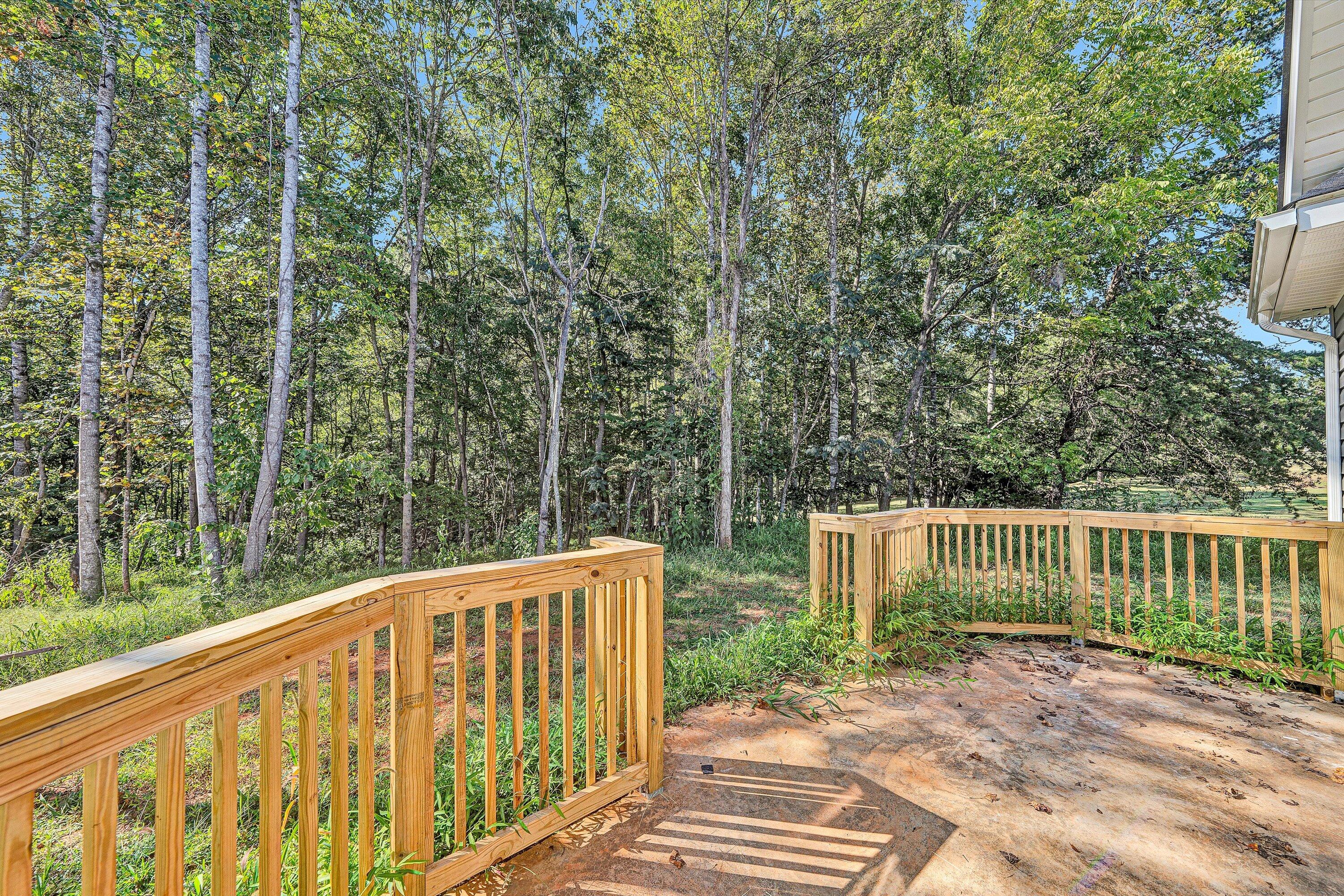 3769 Hales Ford Road Moneta, VA 24121 - Photo 24 of 26 a view of deck with wooden fence and trees