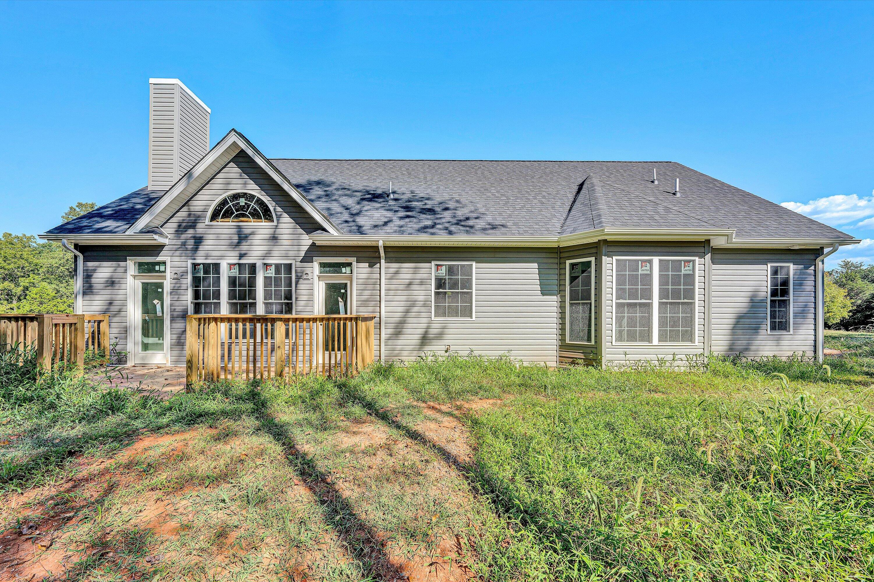 3769 Hales Ford Road Moneta, VA 24121 - Photo 26 of 26 a front view of a house with a yard and porch