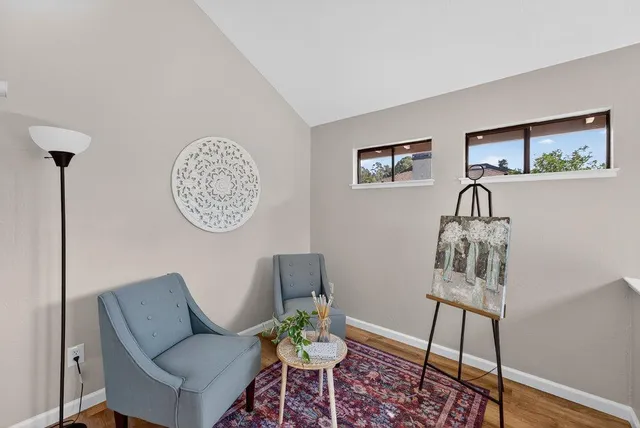a living room with furniture and a window