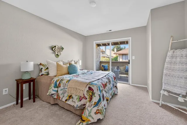 a view of two chairs in the balcony