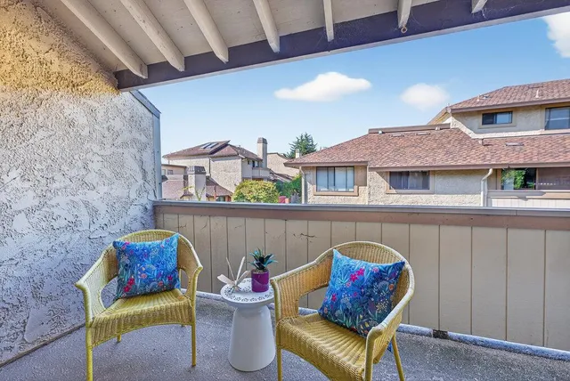 a bathroom with a granite countertop bathtub sink vanity mirror and toilet