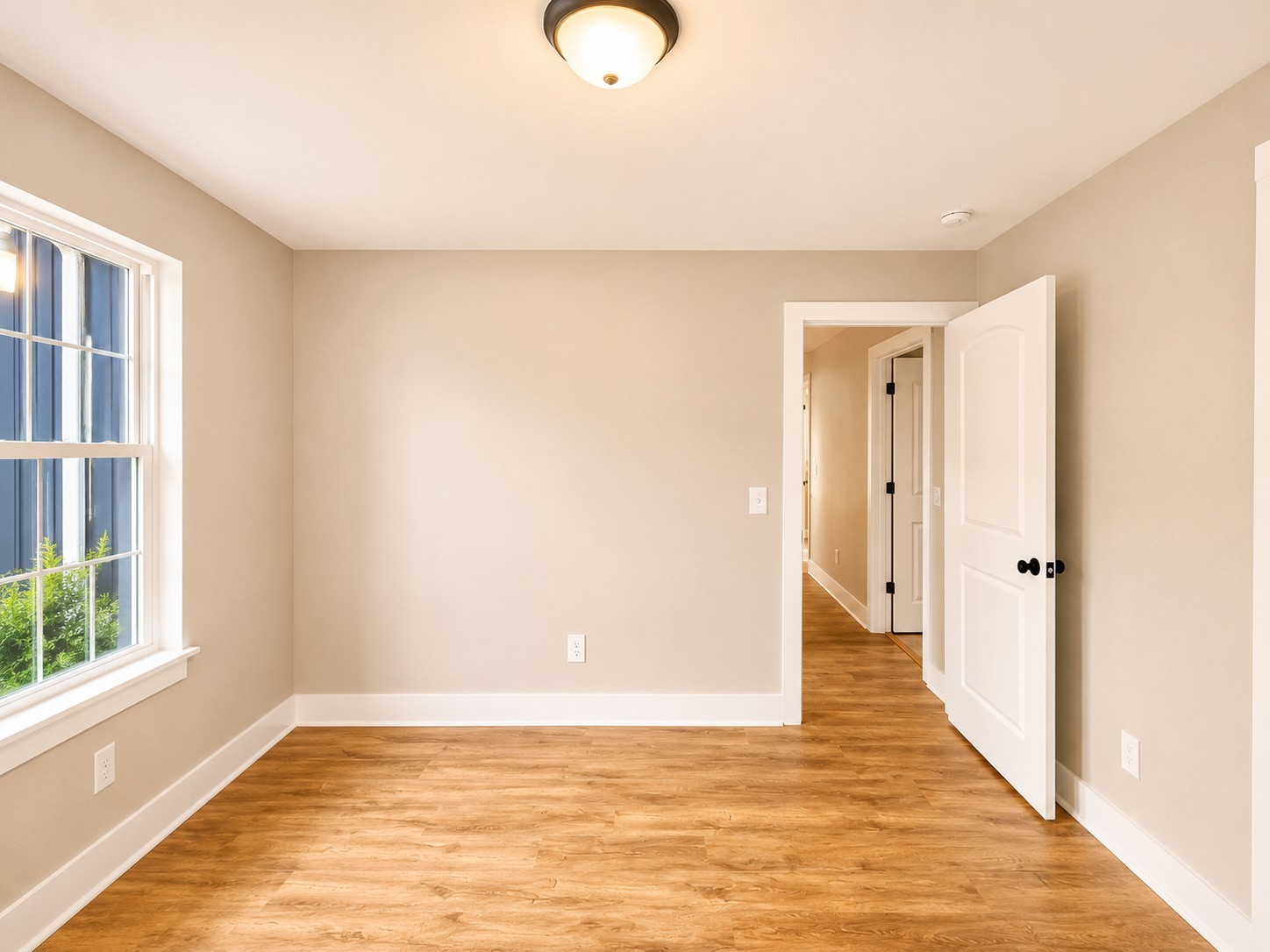 4603 Chapel Hill Road Southside, TN 37171 - Photo 19 of 26 a view of an empty room with wooden floor and window