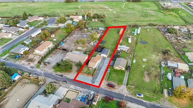 an aerial view of a houses with outdoor space