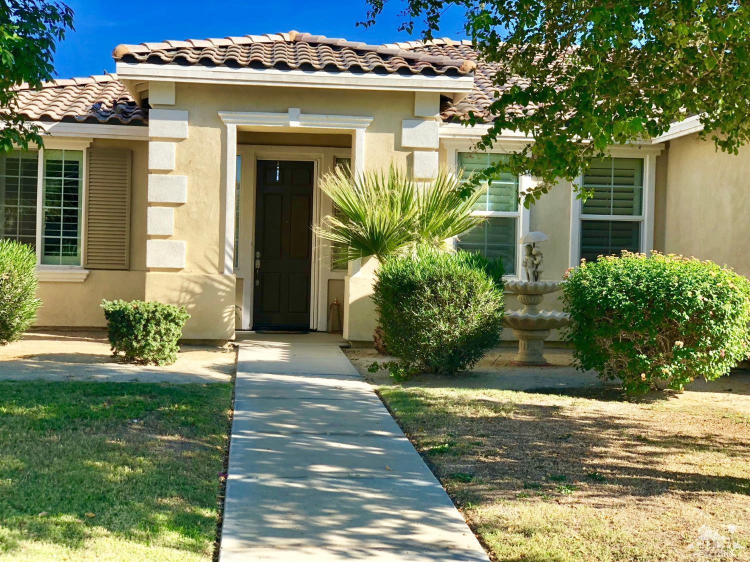 83316 Lone Star Road Indio, CA 92203 - Photo 1 of 43 a front view of a house with a yard