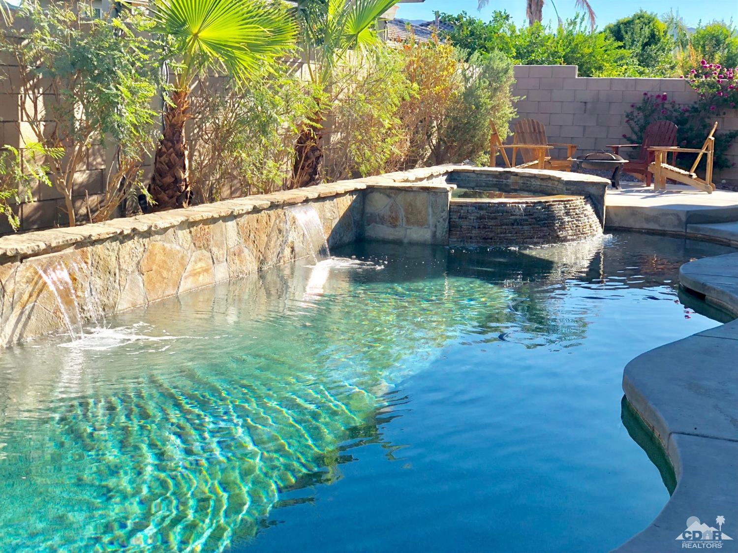 83316 Lone Star Road Indio, CA 92203 - Photo 2 of 43 a backyard of a house with table and chairs