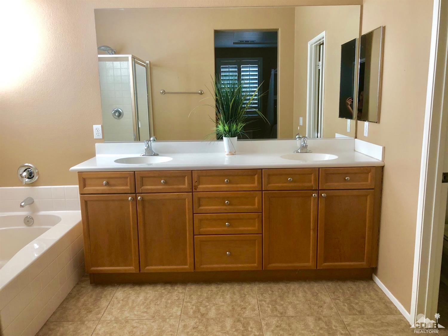 83316 Lone Star Road Indio, CA 92203 - Photo 22 of 43 a bathroom with a sink and a mirror