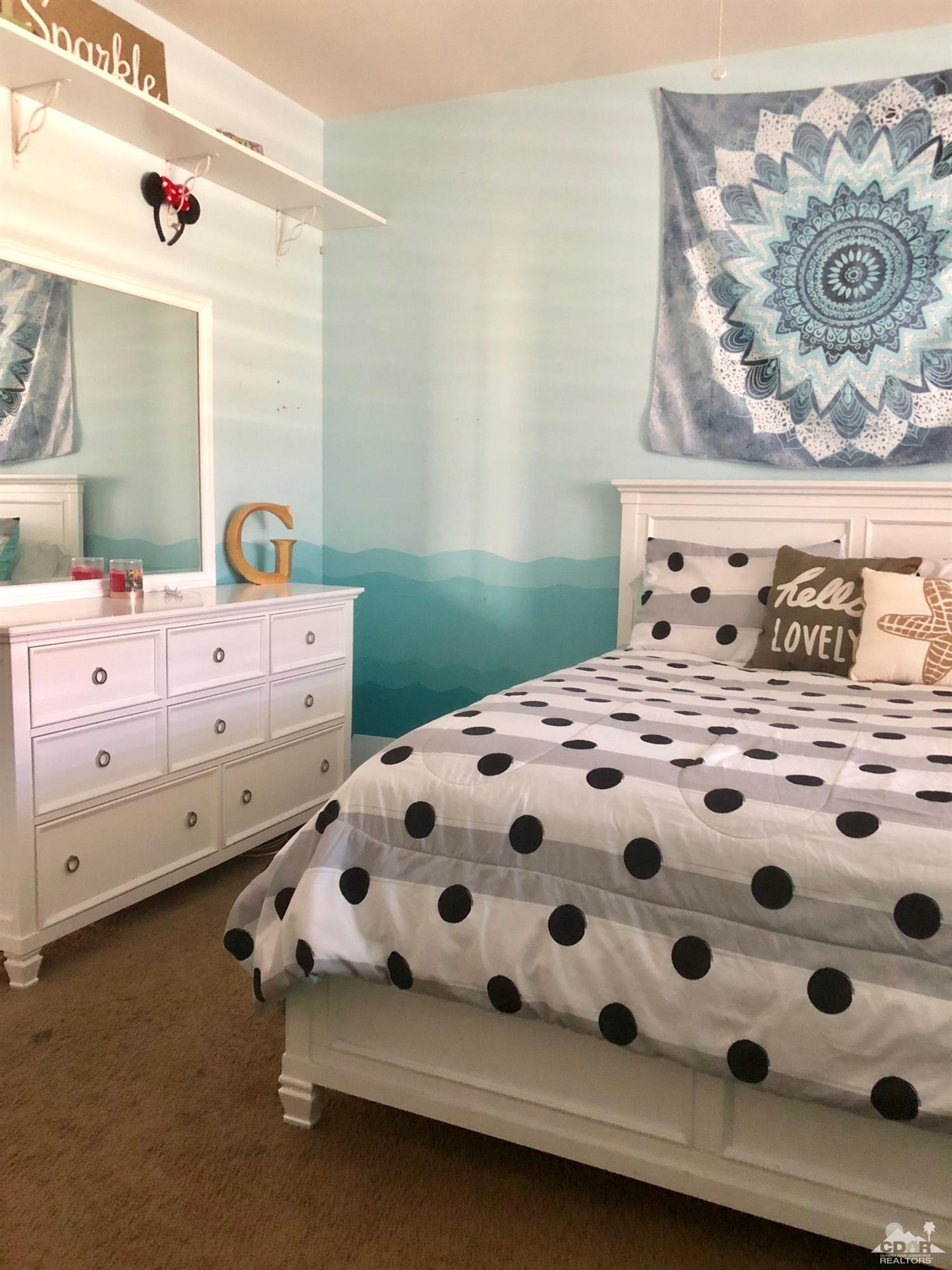 83316 Lone Star Road Indio, CA 92203 - Photo 26 of 43 a bedroom with a bed and a dresser