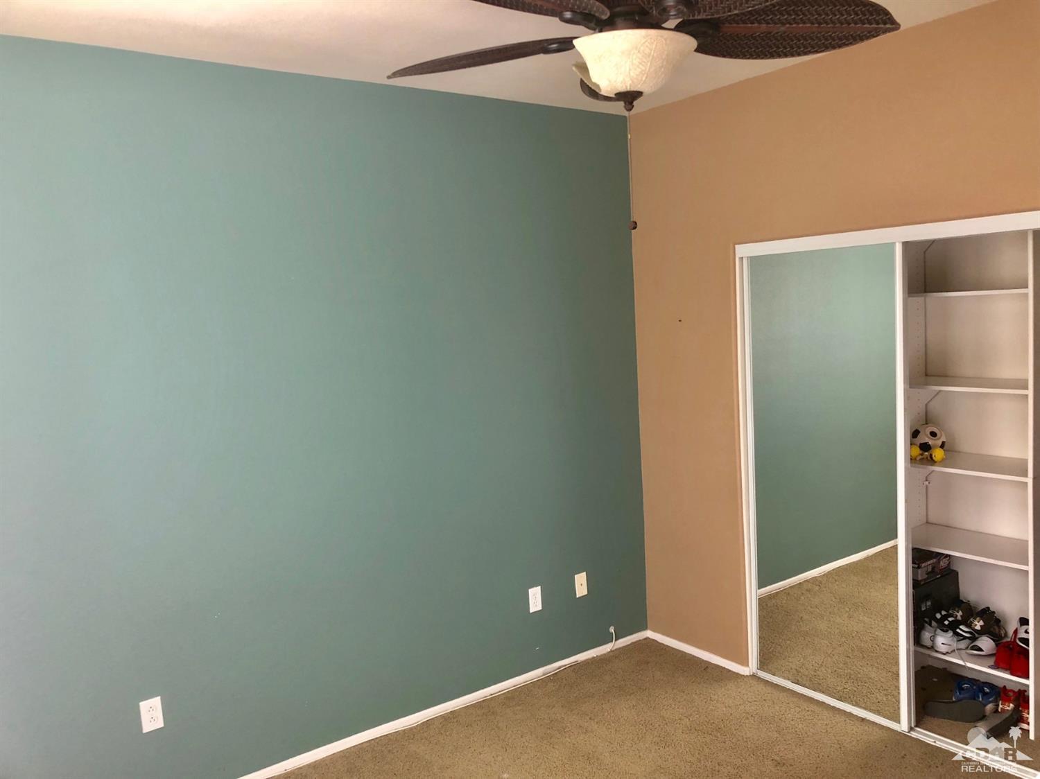 83316 Lone Star Road Indio, CA 92203 - Photo 34 of 43 a view of a room with a chandelier fan