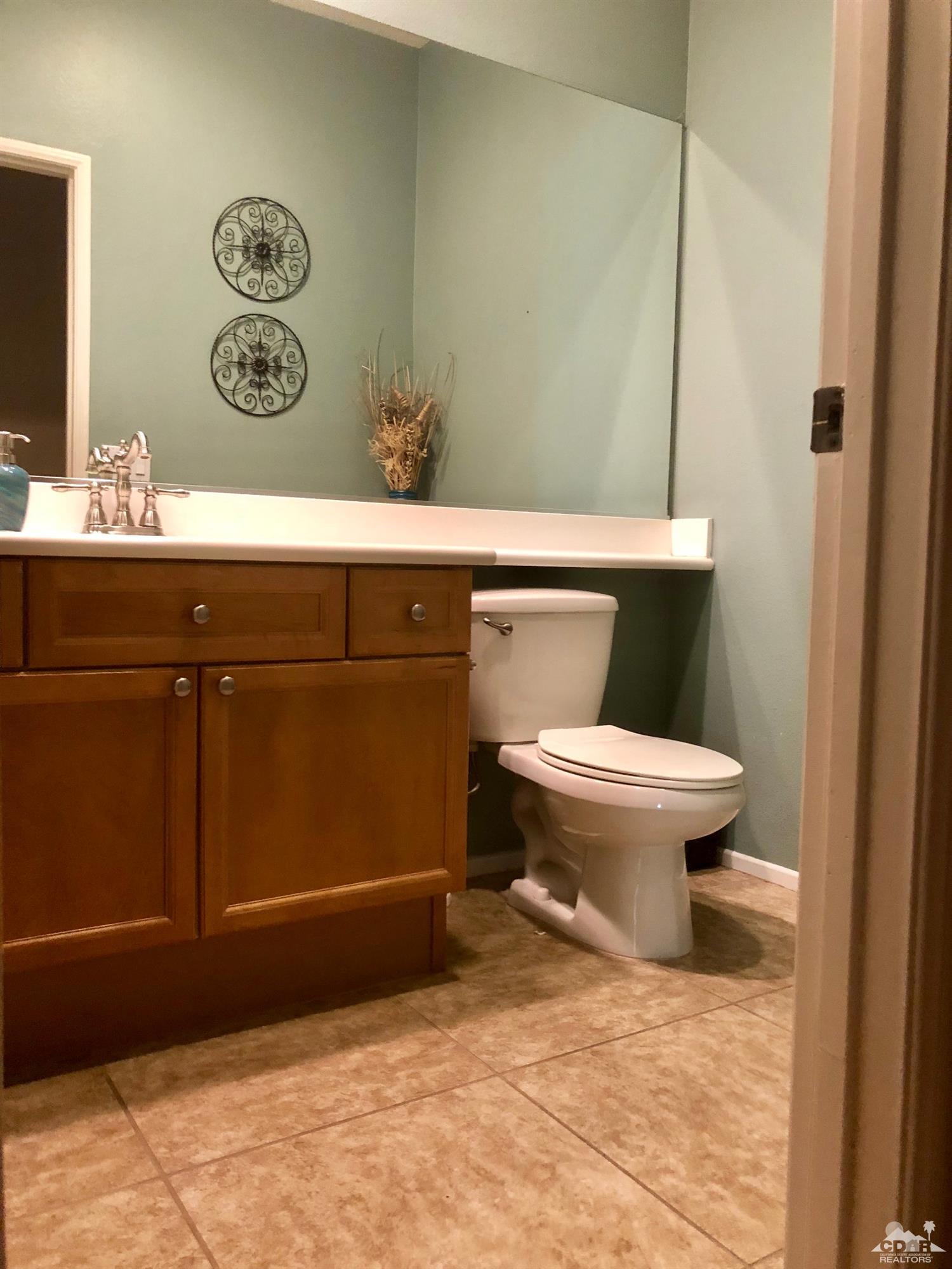 83316 Lone Star Road Indio, CA 92203 - Photo 35 of 43 a bathroom with a toilet and a sink