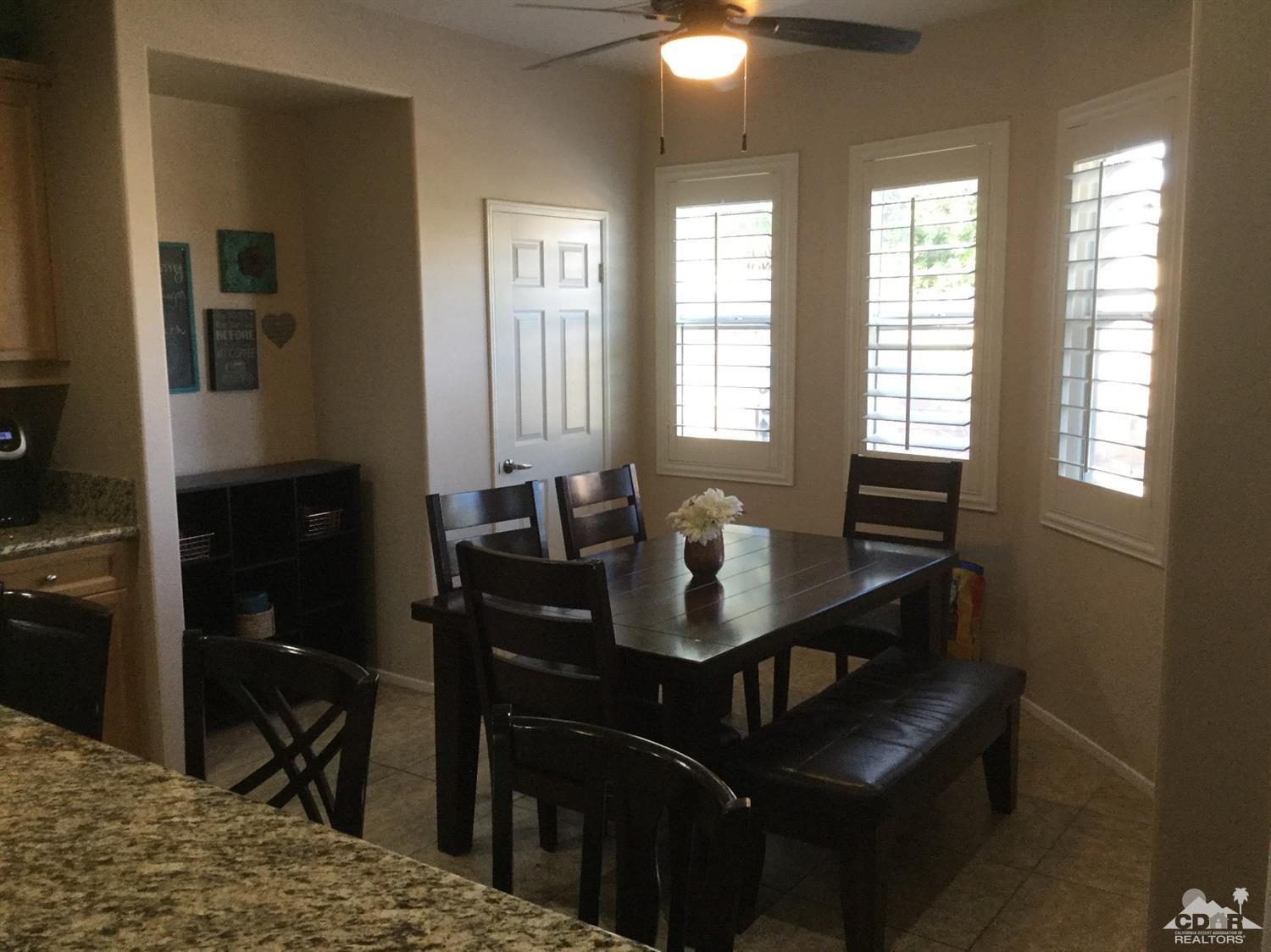 83316 Lone Star Road Indio, CA 92203 - Photo 5 of 43 a view of a dining room with furniture