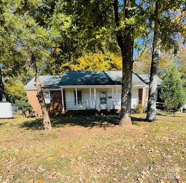 1421 Tyvola Road Charlotte, NC 28210 - Photo 1 of 23 a front view of a house with a yard covered in snow