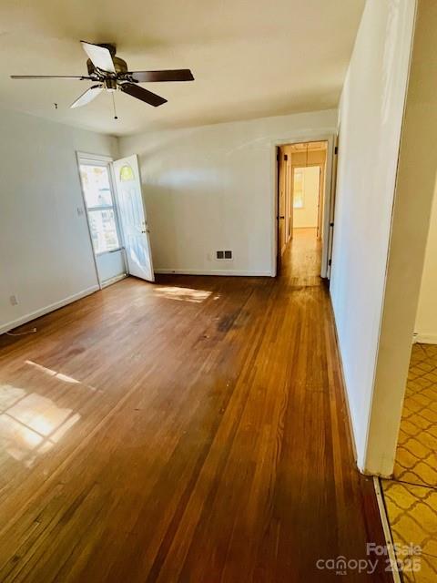 1421 Tyvola Road Charlotte, NC 28210 - Photo 11 of 23 an empty room with wooden floor and windows