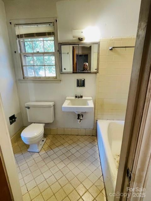 1421 Tyvola Road Charlotte, NC 28210 - Photo 14 of 23 a bathroom with a sink toilet and shower