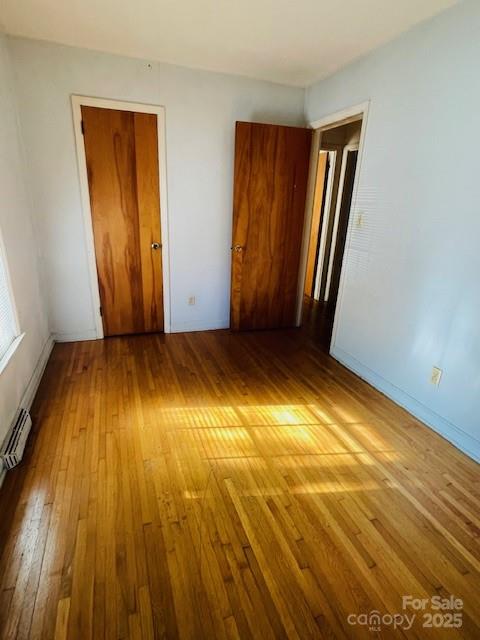 1421 Tyvola Road Charlotte, NC 28210 - Photo 17 of 23 a view of empty room with wooden floor