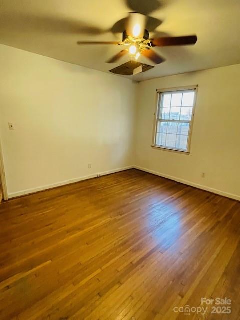 1421 Tyvola Road Charlotte, NC 28210 - Photo 22 of 23 a view of an empty room with a window and wooden floor