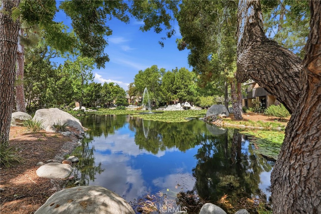7890 East Spring Street, Unit 2L Long Beach, CA 90815 - Photo 36 of 47 a view of a lake with houses