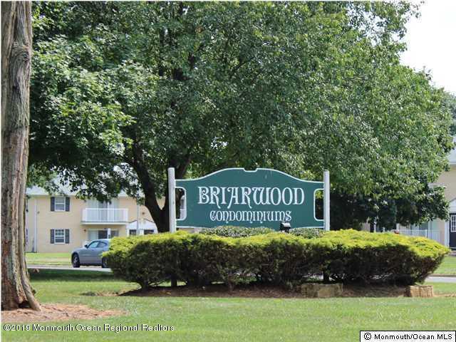 509 Harding Road, Unit 6 Freehold, NJ 07728 - Photo 1 of 15 a sign that is sitting on a brick wall