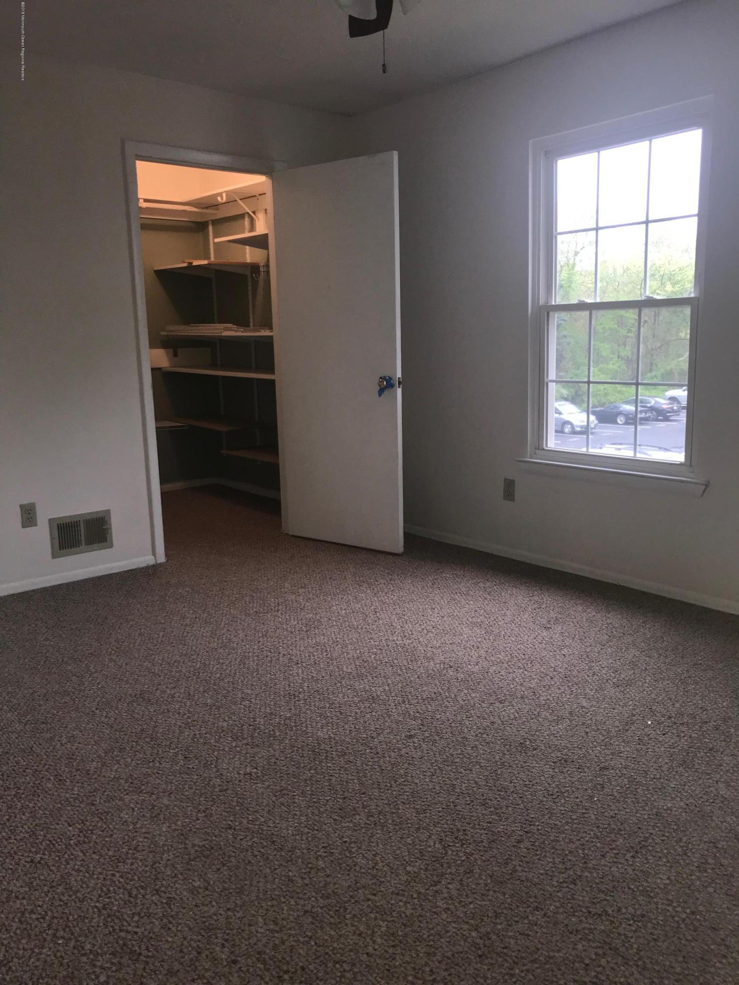 509 Harding Road, Unit 6 Freehold, NJ 07728 - Photo 11 of 15 a view of an empty room with a window