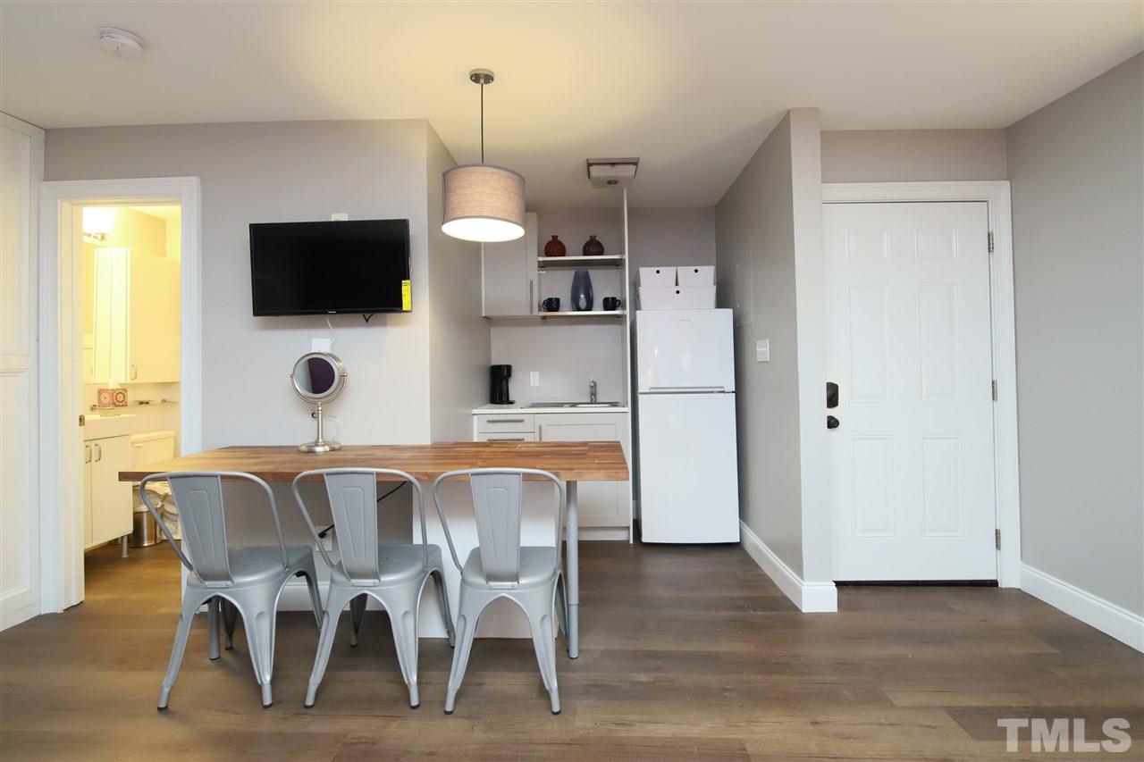 815 Clay Street Raleigh, NC 27605 - Photo 14 of 30 a view of a dining room with furniture window and wooden floor