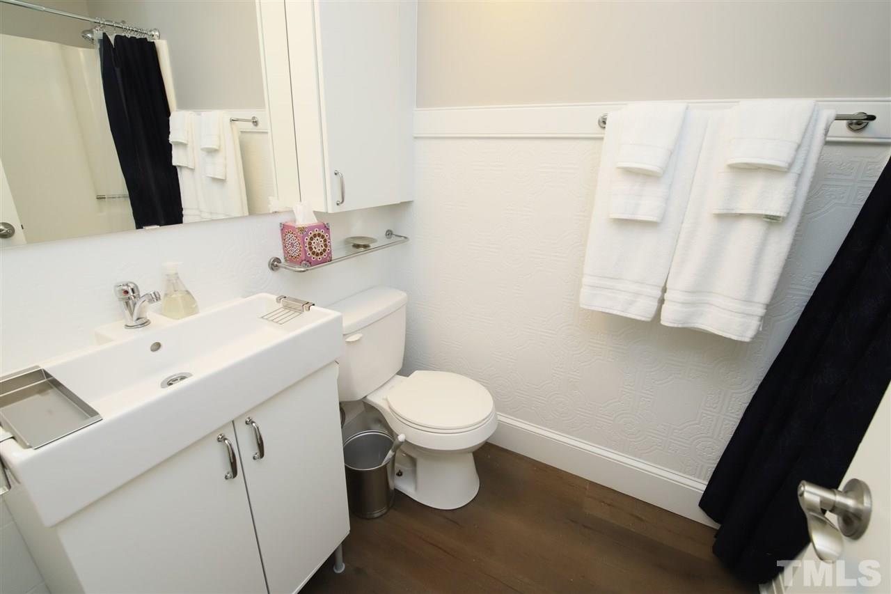815 Clay Street Raleigh, NC 27605 - Photo 16 of 30 a bathroom with a sink toilet and mirror
