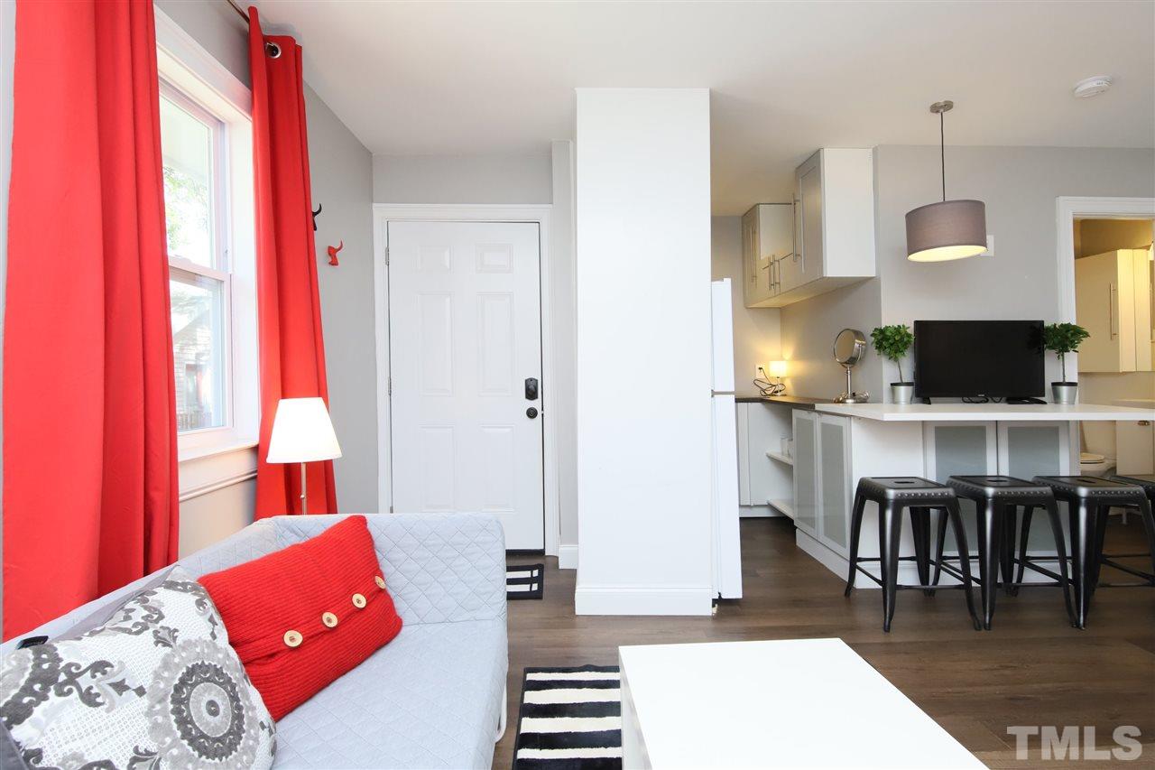 815 Clay Street Raleigh, NC 27605 - Photo 18 of 30 a living room with furniture and wooden floor