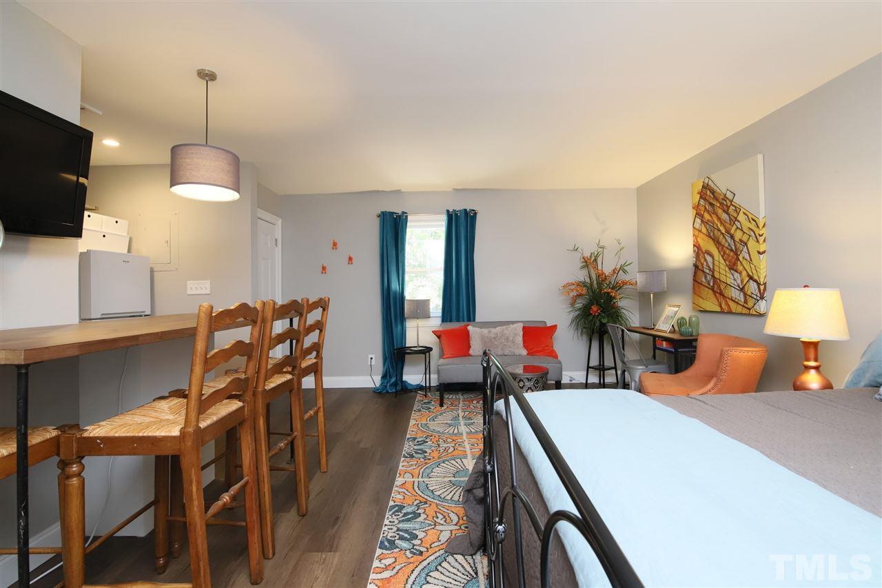 815 Clay Street Raleigh, NC 27605 - Photo 25 of 30 a living room with furniture and a flat screen tv