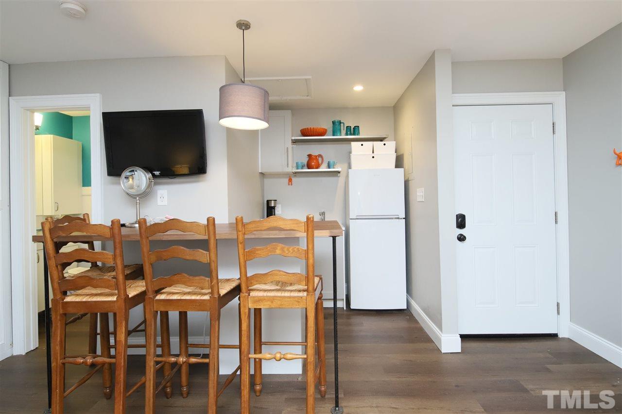 815 Clay Street Raleigh, NC 27605 - Photo 28 of 30 a dining room with furniture and wooden floor