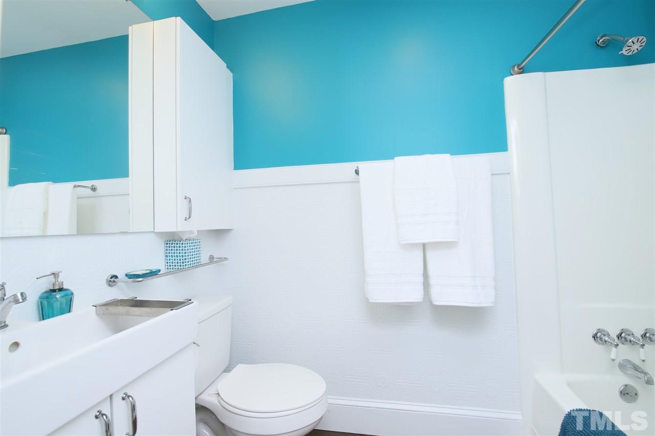 815 Clay Street Raleigh, NC 27605 - Photo 30 of 30 a bathroom with a sink a toilet and vanity