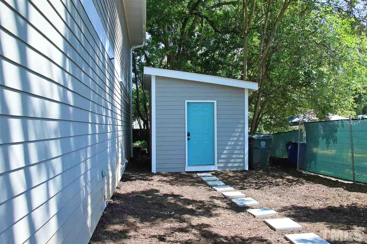 815 Clay Street Raleigh, NC 27605 - Photo 4 of 30 a view of a house with a backyard