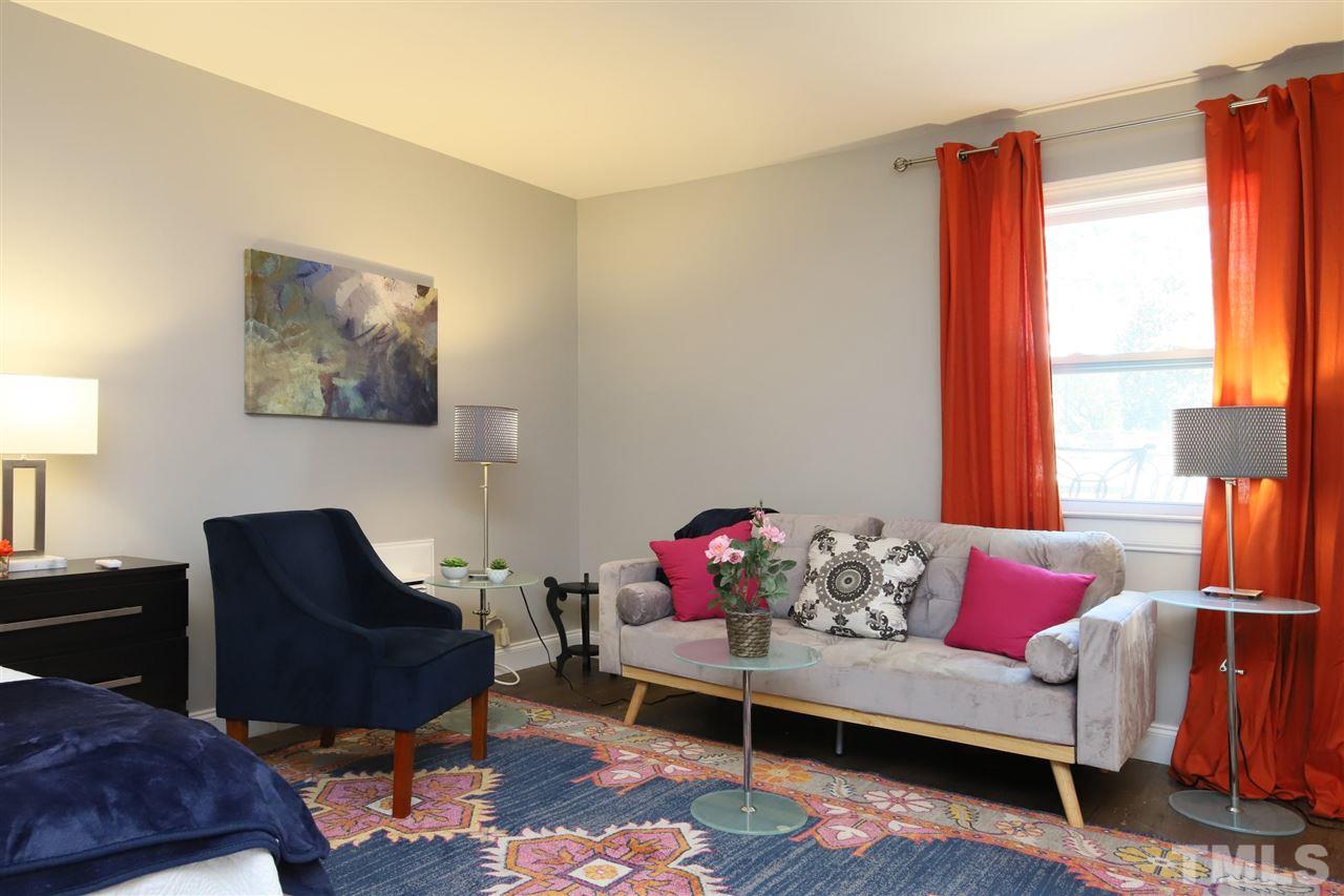 815 Clay Street Raleigh, NC 27605 - Photo 8 of 30 a living room with furniture and a window