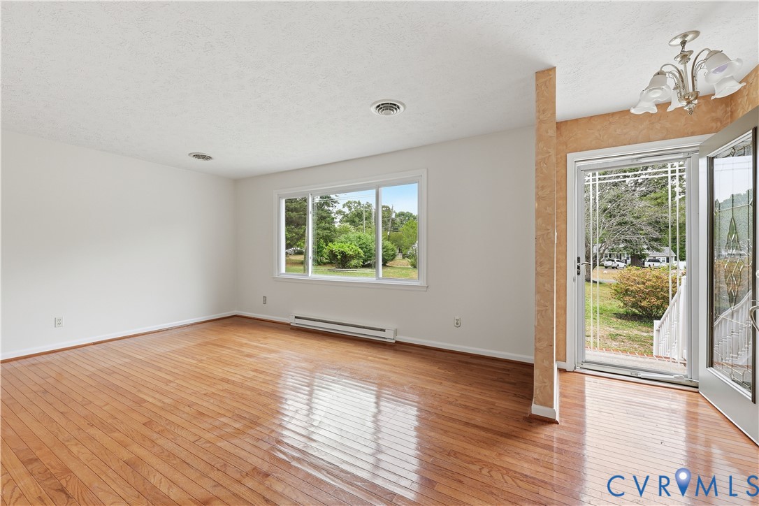 22925 River Road Petersburg, VA 23803 - Photo 13 of 27 Hardwood flooring throughout a bright room featuri