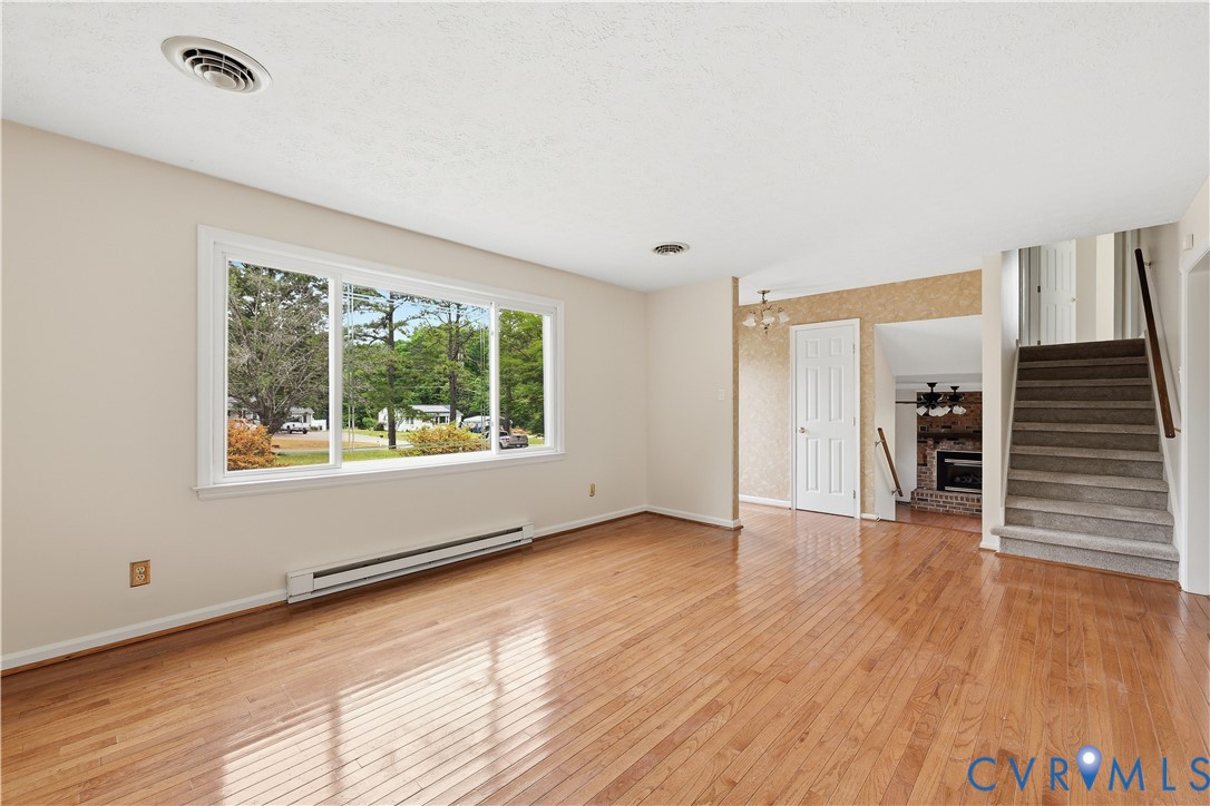22925 River Road Petersburg, VA 23803 - Photo 14 of 27 Spacious living area featuring expansive wood-fini